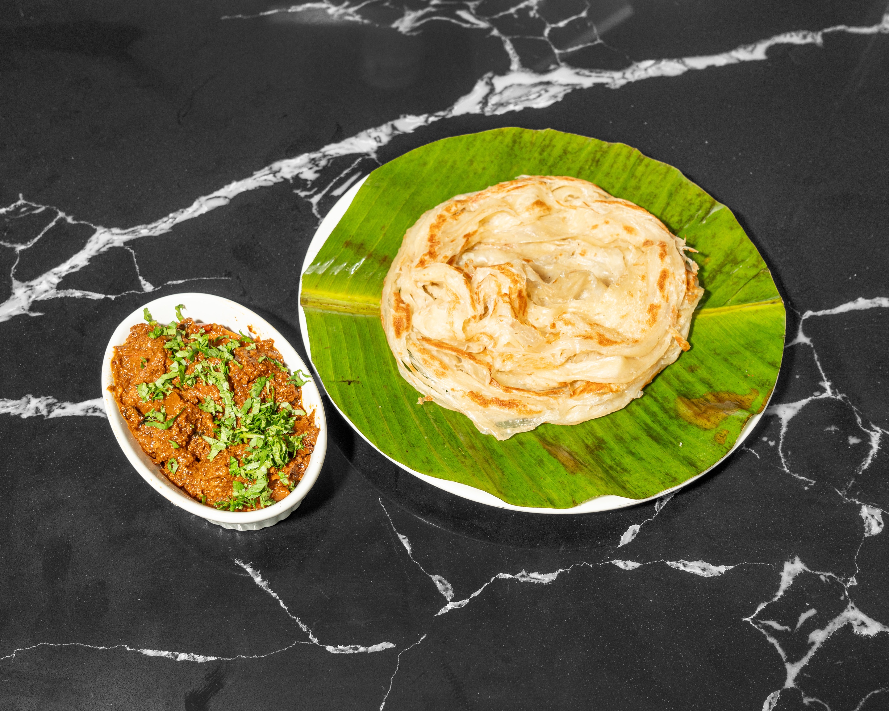 Kerala Kizhi Porotta with Beef Roast